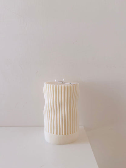 Light up your atmosphere with an eye-catching Wavy Pillar Candle! It adds fun, flair, and plenty of wavy-style ambiance to any room. Get creative with the way you arrange it, and lift the mood! 