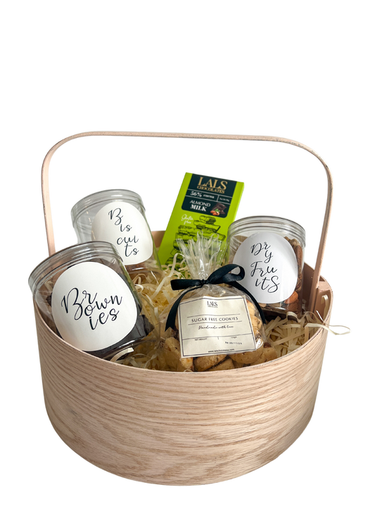Introducing our 'Sugar-Free' hamper, curated for health-conscious individuals and diabetics. This thoughtfully crafted collection offers a delicious array of guilt-free treats, making it easy to satisfy your sweet cravings without compromising on their health.  Pick between a keepsake wooden basket or ivory gift box! 