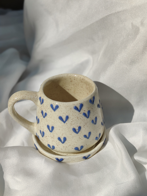 blue round shaped heart mugs